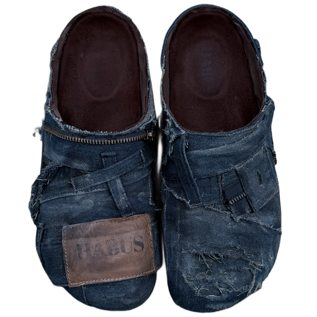 Pair of denim shoes with a visible brand label on a white background
