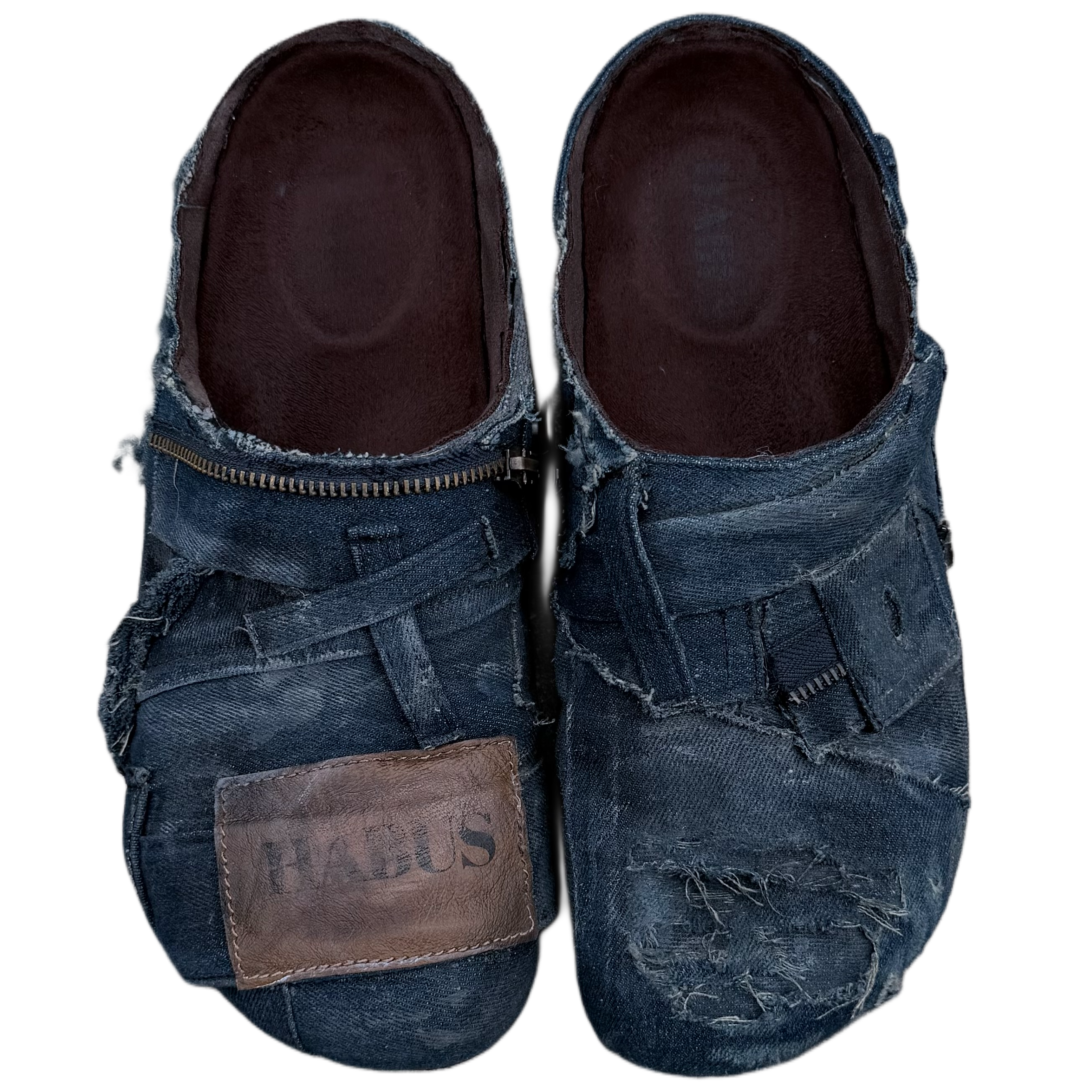 Pair of denim shoes with a visible brand label on a white background